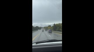 A motorist has filmed an enormous gathering of what appears to be clouds suspended beneath the sky.