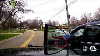Newly-released video shows Solon officer fire at suspect with gun in hand