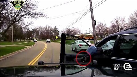 Newly-released video shows Solon officer fire at suspect with gun in hand