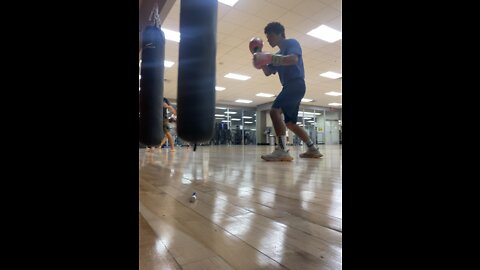 Upcoming boxer. Aquiles Chavez on heavy bag.
