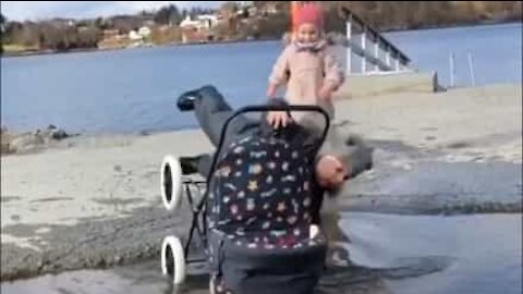 Kid falls into puddle