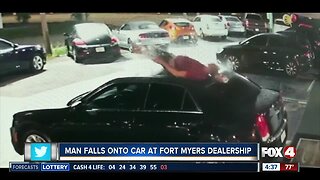Man falls off roof onto car at Fort Myers business