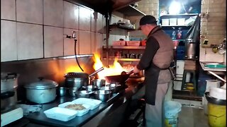 Chinese Chef Cooking Amazing Food At The Panorama Flea Market