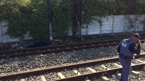 SOUTH AFRICA - Cape Town - The corpse of a young male lay alongside the train track in Southfield. (Video) (jHA)