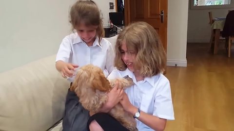 Sisters emotional after new puppy surprise
