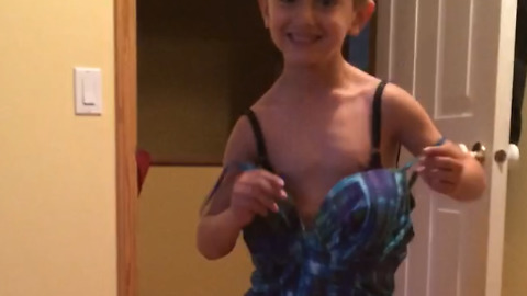 A Boy Dances In His Mom’s Swimsuit And Her High Heels