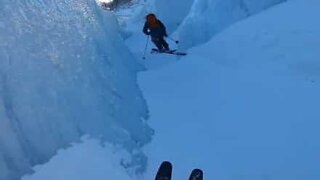 Skiers hurtle through narrow ice-packed gorge