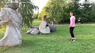Young man uses friend's face to do backflip