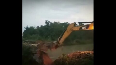 Attempting to Demolish A Bridge, Bulldozer Crashes Into Water Too, Driver Escapes