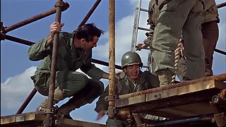 Lee Marvin shows Trini Lopez how to climb rope in The Dirty Dozen 1967