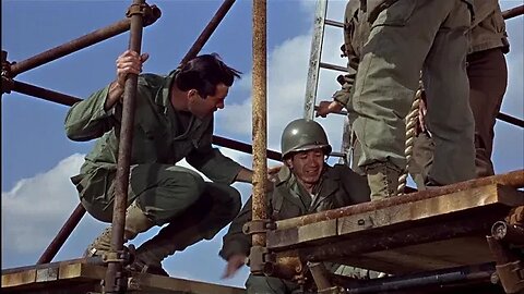 Lee Marvin shows Trini Lopez how to climb rope in The Dirty Dozen 1967