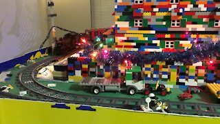 Lego Train going around Buckingham Palace which is decorated for Christmas