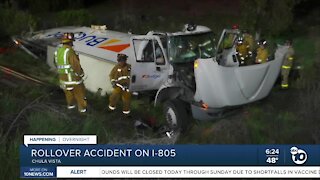 Box truck rolls over, crashes off I-805