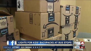 Activists giving away LED lights for kids to put on backpacks