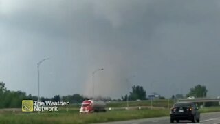 Tornado forms and spins beside Quebec highway