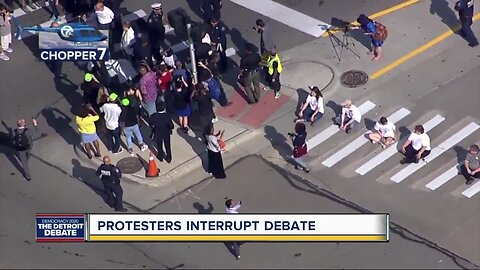 Protesters demonstrate during Detroit debate