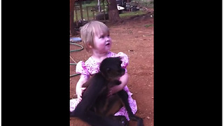 Pet monkey adorably cuddles with little girl