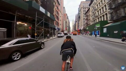 Bike Messenger Riding Fast and Fluid Through NYC Traffic