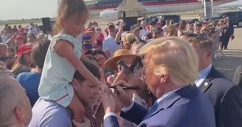 Trump Signs Young Supporter's Hand