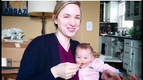 Baby laughs at her mama eating banana Crips chips