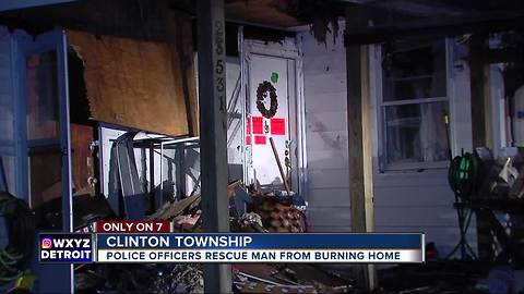 Clinton Township police wake sleeping man, rescue him from burning house