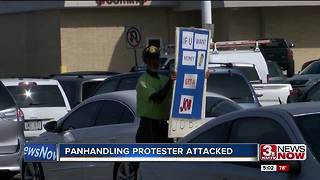 Panhandling protester attacked again