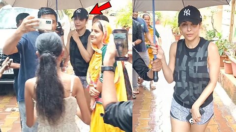 Malaika Arora Braving the Rain to Take Selfies with Fans Holding an Umbrella