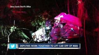 Deputies use brute force to save man from being crushed under flipped car