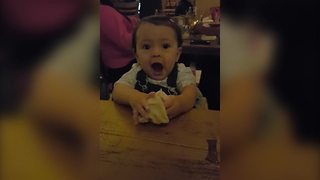 "A Tot Baby Plays with Dough in A Restaurant"