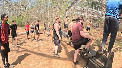 Fat man recovers on the rings at the Spartan Sprint
