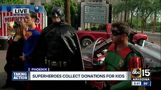 Superheroes collecting donations for kids in Phoenix Saturday