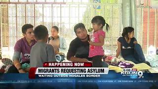 Central American migrants seeking asylum; waiting outside Nogales port