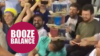 Hilarious moment cricket fans stack drinks on a sleeping fan