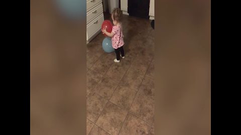 Tot Girl Having Fun With Balloons