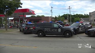 Two officers hurt during gas station arrest
