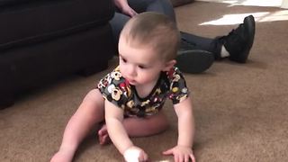 Confused Baby Tries To Pick Up Light Reflection
