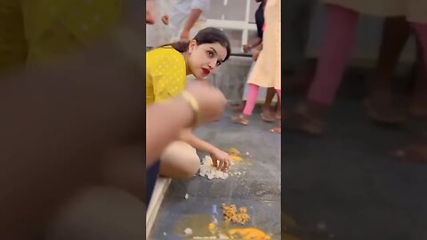 Devotees eat prasad on the ground at the Udupi Krishna temple