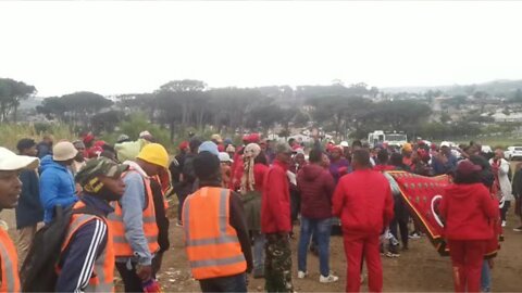 Eff supporters gather on an open piece of land opposite Kayamandi ahead of their planned March to the Remgro head office in Stellenbosch.