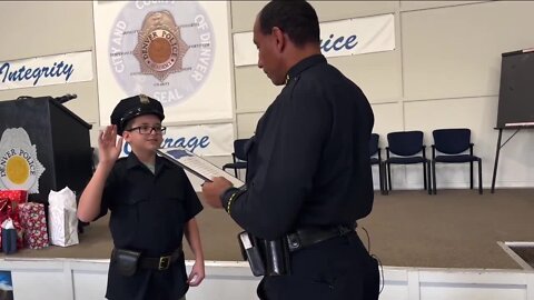 Denver teen shot on his way home from school in August becomes honorary police officer for a day