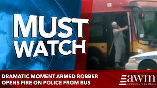 Dramatic moment armed robber opens fire on police from bus