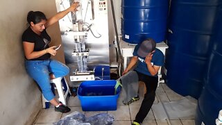 Machine Fills Small Bags Of Purified Water