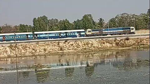 Express train passing | i captured express train passing middle of railway station and lake