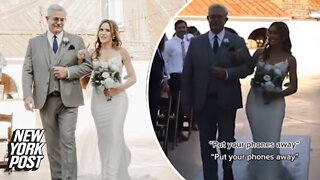 Bride angrily tells guests to put phones away as she walks down aisle