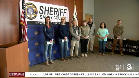 Sarpy County Sheriff's Office presents donations to area nonprofits
