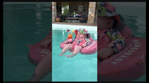 Baby Relaxes in Pool