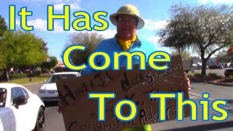 BEGGING FOR SUBSCRIBERS!! A CARDBOARD SIGN, A Walmart stop light at The Villages. It's come to this