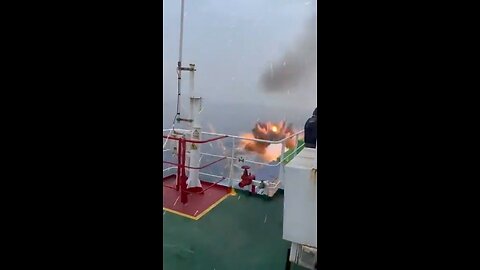 A cargo ship 🚢 takes out a pirate 🏴‍☠️ boat 🛥️ out at sea 🌊