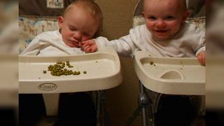 Twin Baby Shares Food With Sleepy Brother