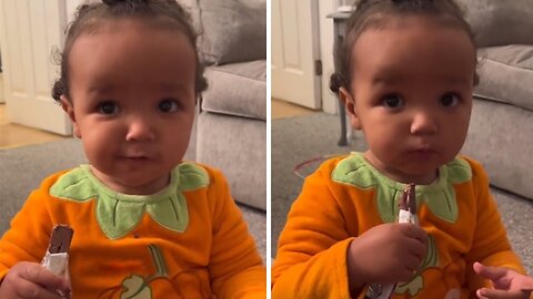 Adorable toddler gets ready for Halloween