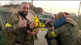 Villagers greet Ukrainian soldiers with flowers